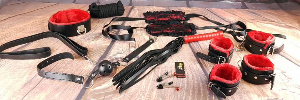 Advanced Femdom Practices: BDSM toy kit with cuffs, flogger, gag and restraints, representing advanced tools for female domination.
